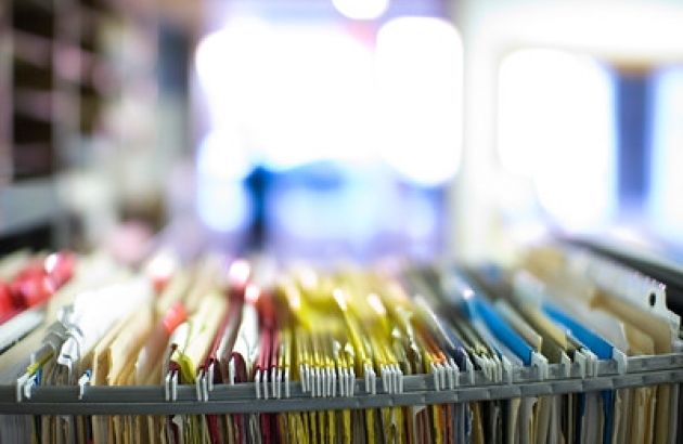 Image of hanging files in an open cabinet drawer. "order" by paul goyette is licensed under CC BY-NC-SA 2.0.