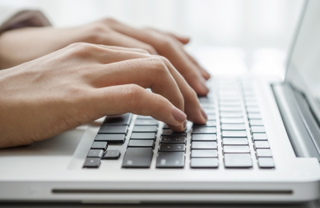 image of fingers on a keyboard